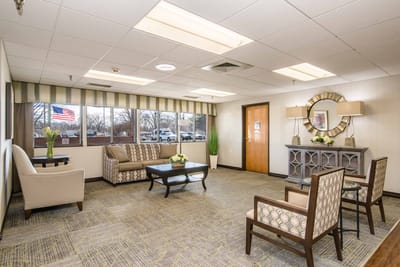 Bright common area with seating and natural light