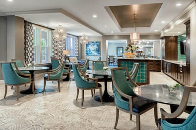 Dining area with tables and chairs in a modern setting