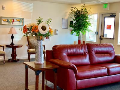 Cozy common area with seating and decorative flowers