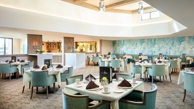 Elegant dining room setup with tables and chairs
