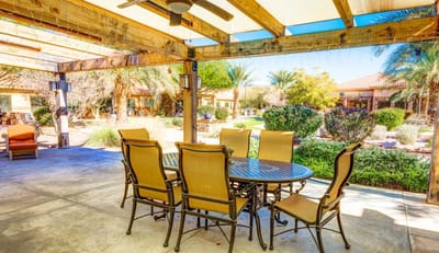 Outdoor dining area with table and chairs