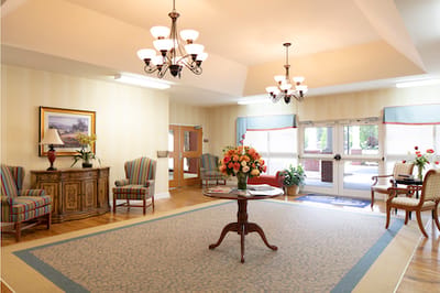 Bright common area with seating and floral decor