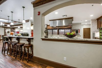 Interior view of a dining area with kitchen
