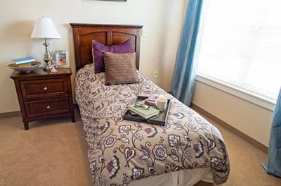 Cozy resident room with a bed and decor