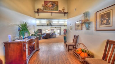 Bright lobby area with chairs and decorative items