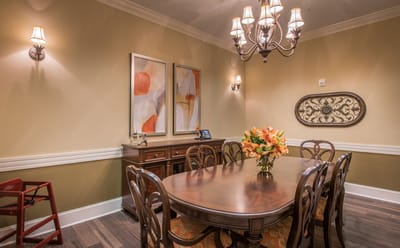 Elegant dining room with a large table and floral centerpiece