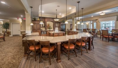 Spacious dining room with kitchen area and seating