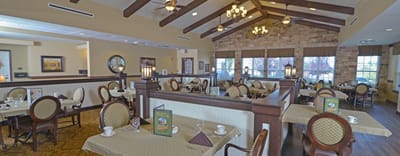 Dining room with elegant seating and table settings