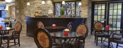 Cozy dining area with tables and floral decorations