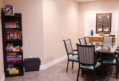 Interior view of a common area with games and a table