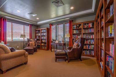 Cozy reading room with bookshelves and comfortable seating