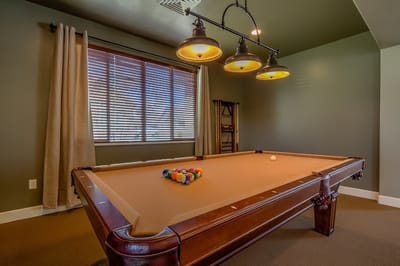 Interior view of a game room with a pool table