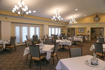 Dining room set with tables and chairs in a bright interior