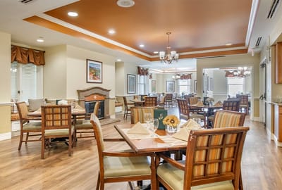 Dining room with tables set for residents