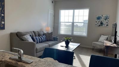 Bright living area with comfortable seating and decor
