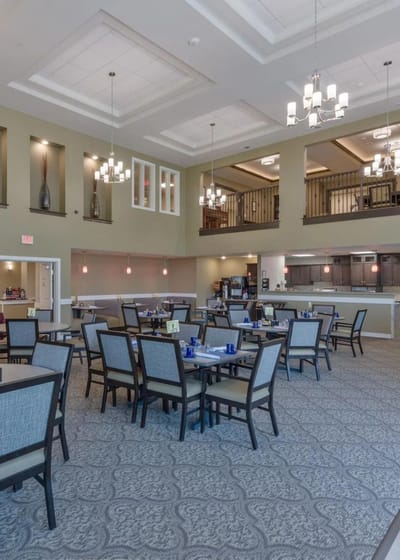 Bright dining room with tables and chairs arranged