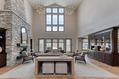 Bright and spacious common area with seating and windows