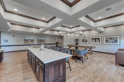 Bright common area with seating and artwork on walls