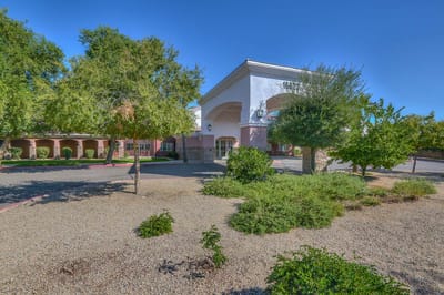 Exterior view of a senior living facility with landscaping