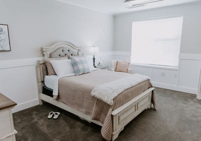 A well-furnished private resident room with natural light