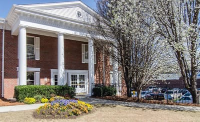 Exterior view of Decatur Center with blooming trees and flowers