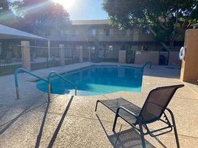 Outdoor pool area with seating chairs