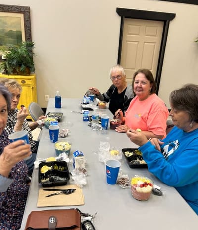 Residents enjoying a meal together in a common area
