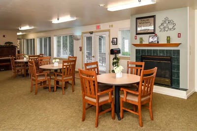 Bright dining area with wooden tables and chairs