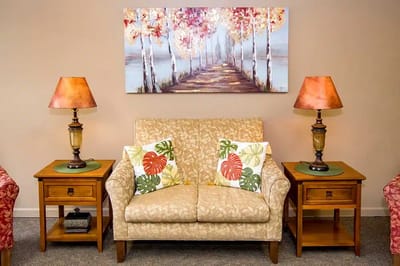 Cozy living room with warm lighting and artwork