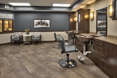 Modern hair salon area with styling chairs and decor