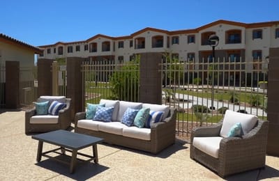Outdoor seating area with view of facility building