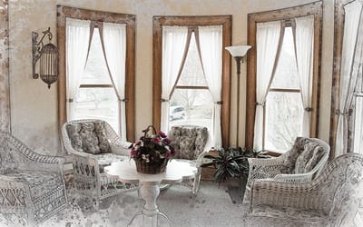 A cozy common area with wicker furniture and natural light