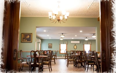 Interior view of a dining room with tables and chairs