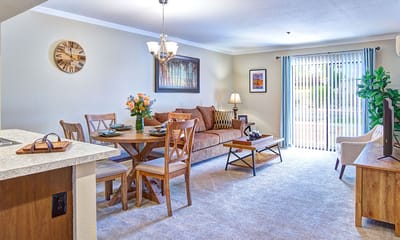 Bright living room setup with dining area