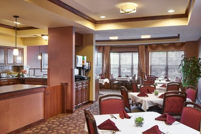 Dining room with tables set for residents