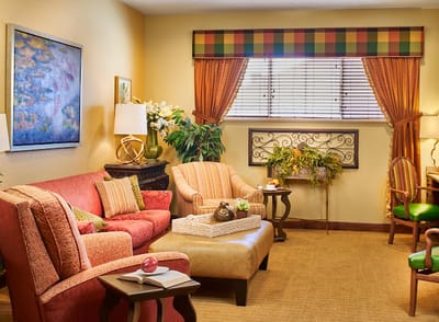 Cozy living room in a senior facility, brightly decorated