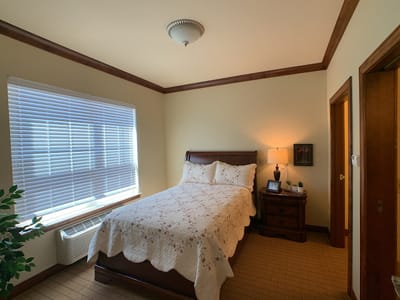 Cozy private resident room with a neatly made bed