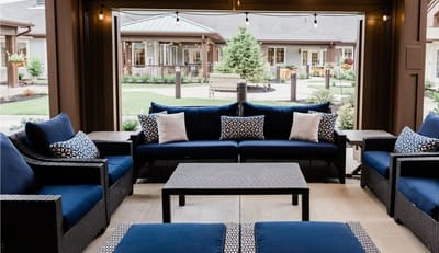 Cozy outdoor seating area with a view of the garden