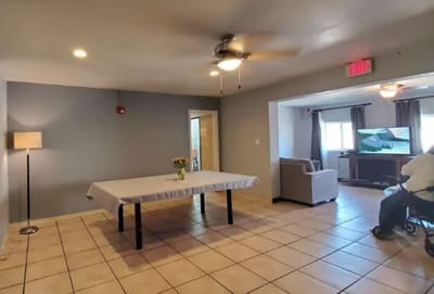 Interior view of a common area with furniture and a table