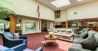 Common area with seating and skylights