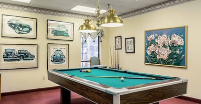 Interior view of a game room with a pool table