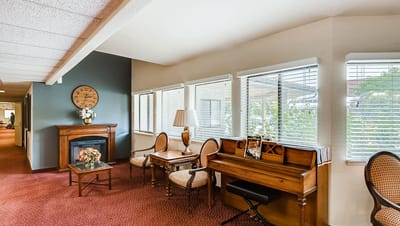 Interior lounge area with piano and seating