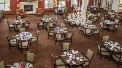 Dining area set for a meal with floral decor