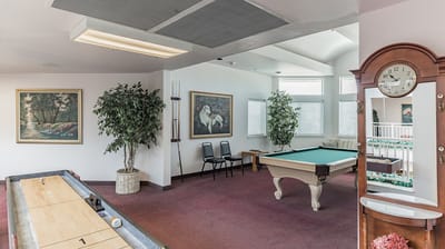 Common area with a pool table and seating