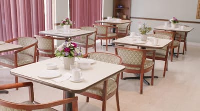Dining room set up with flowers and tableware