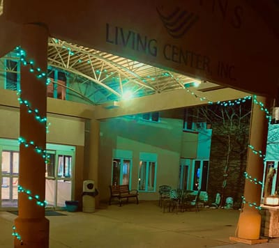 Entrance of Jenkin's Living Center decorated with lights