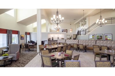 Bright dining room with tables and chandeliers