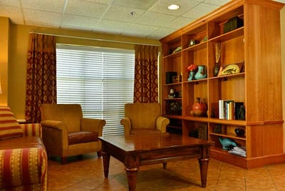 Cozy common area with seating and bookshelves