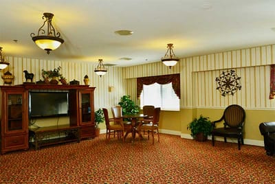 Common area with seating and television in the facility
