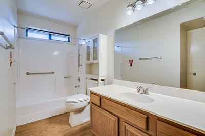 Clean bathroom with modern fixtures and lighting